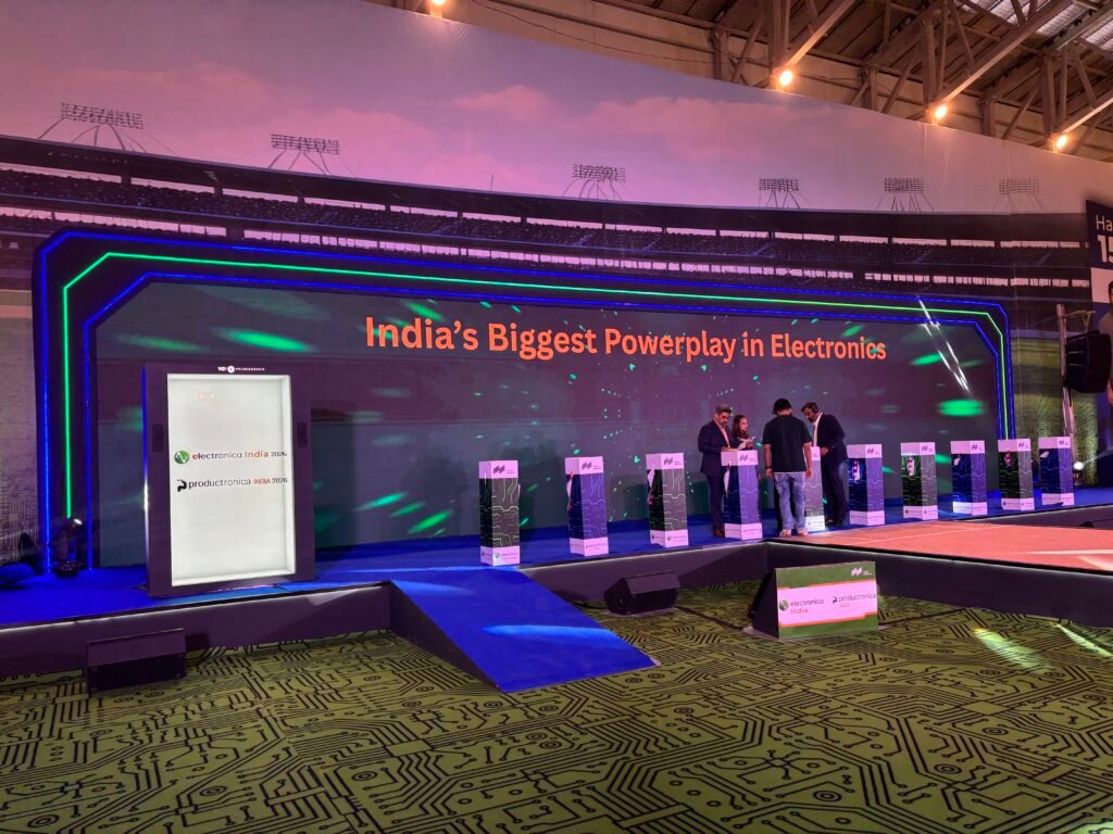 Technology summit event with large stage and presentation screen